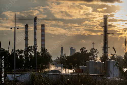 Industrial landscape of a refinery at sunset in the province of Tarragona in Spain photo