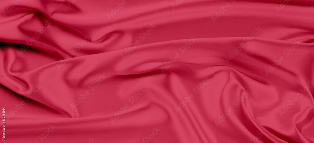 Obraz premium Beautiful viva magenta color banner background with drapery and wavy folds of silk satin material texture. Top view