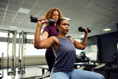 Women weight training at the gym photo