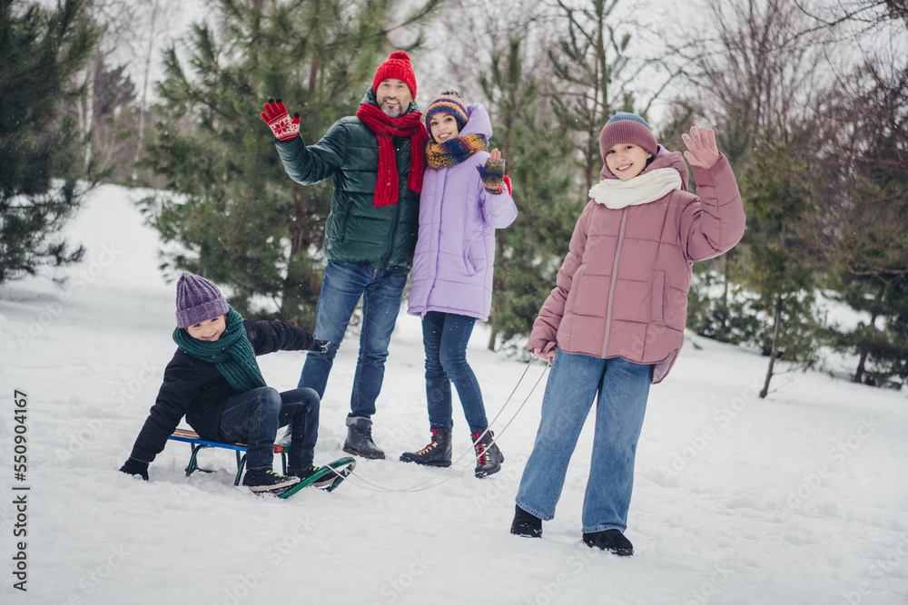 Photo of sweet charming husband wife small kid wear windbreaker sledding spending time together outside urban city park Photo of sweet charming husband wife small kid wear windbreaker sledding spending time together outside urban city park