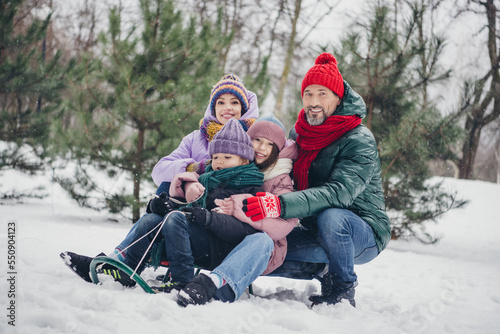 Photo of excited sweet husband wife small kid wear windbreaker having fun together enjoying snowy weather outside urban city park