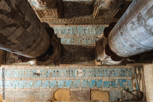 Ancient temple with columns with reliefs and inscriptions photo