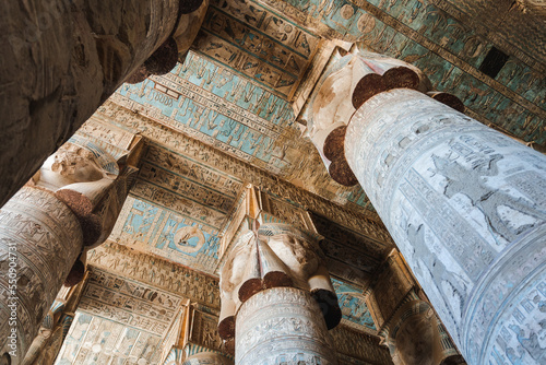 Ancient temple with columns with reliefs and inscriptions photo