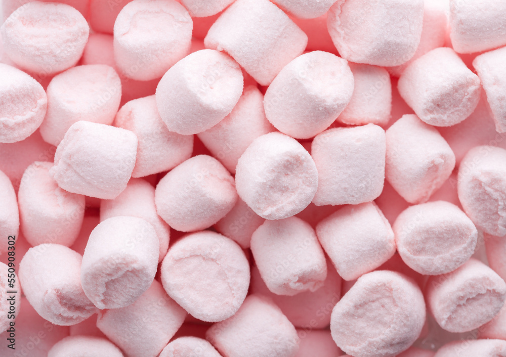 Mini marshmallows of light pink color. Flat lay. Selective Focus.