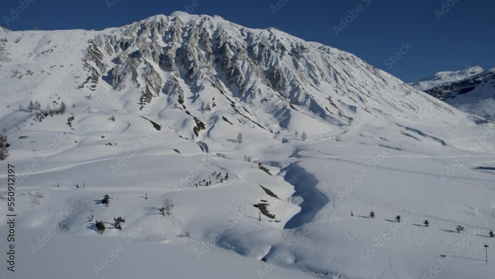 Snow covered mountain daytime drone video Snow covered mountain daytime drone video