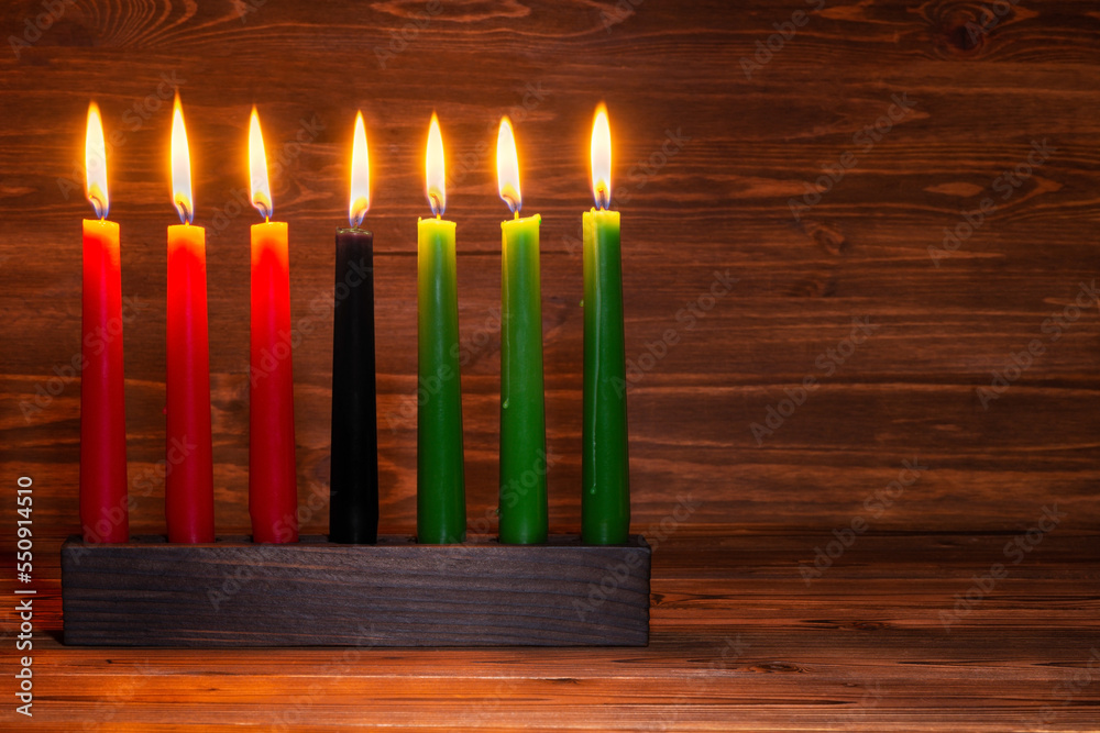Kwanzaa festival concept with seven candles red, black and green in