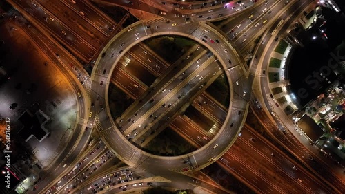 Aerial drone night video of illuminated ring road in Kifisias and Attiki odos avenues, a popular multilevel junction circular road, Attica, Greece photo