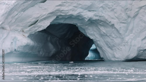 double cave in the iceberg wall photo