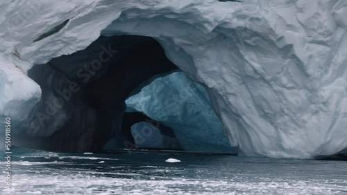 double cave in the iceberg wall photo