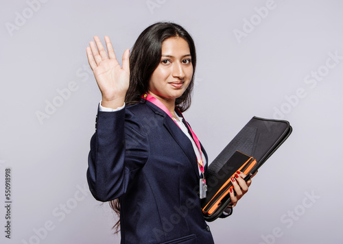 office female colleague send off, isolated on a grey studio back