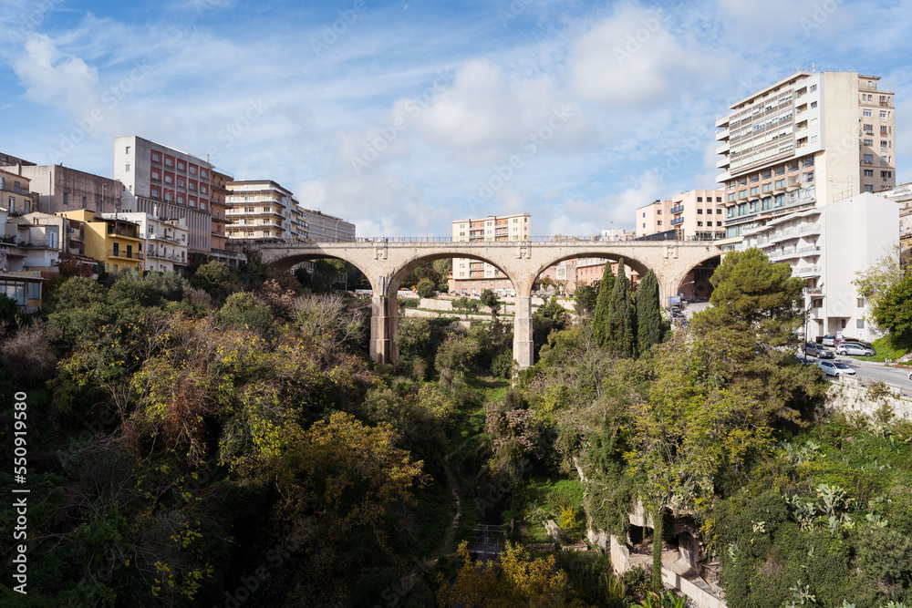 Old bridge between residential buildings