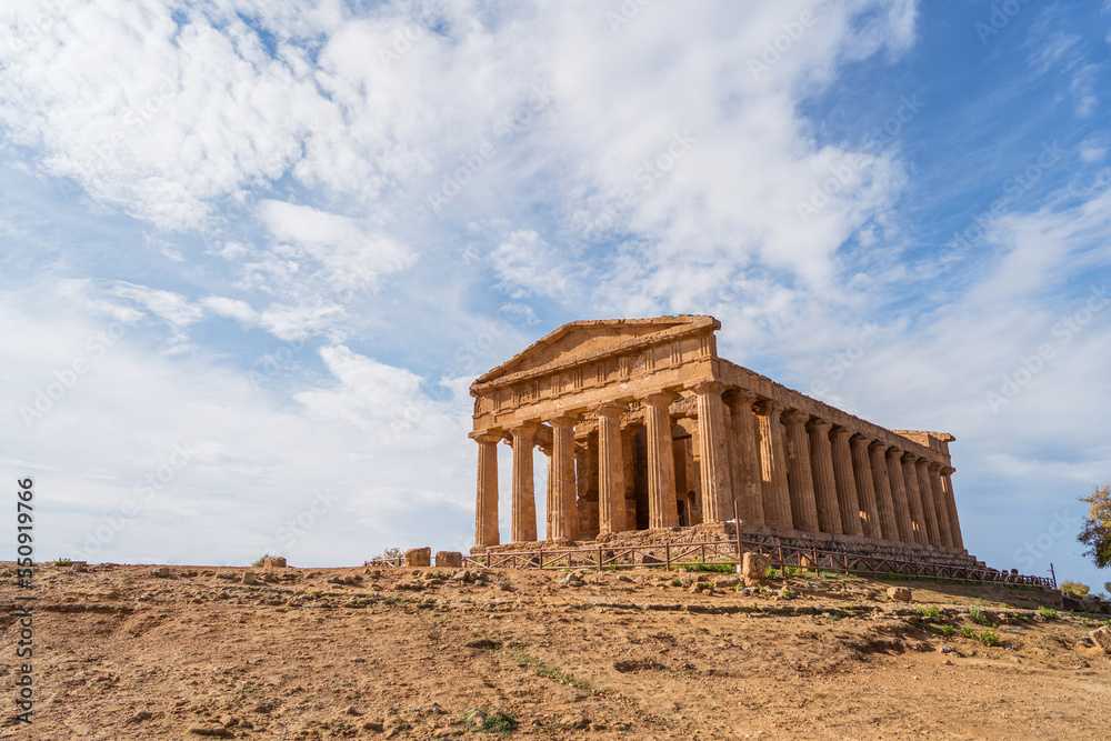 Ancient building with columns under cloudy sky Ancient building with columns under cloudy sky