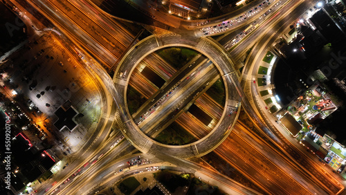 Aerial drone slow shutter night photo of illuminated urban elevated toll ring road junction and interchange overpass passing through Kifisias Avenue, Attica, Greece