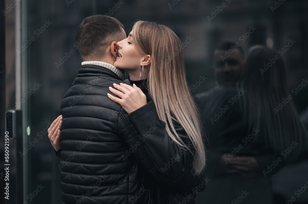 A couple in love in the central metropolis of Ukraine. Love story on the background of skyscrapers