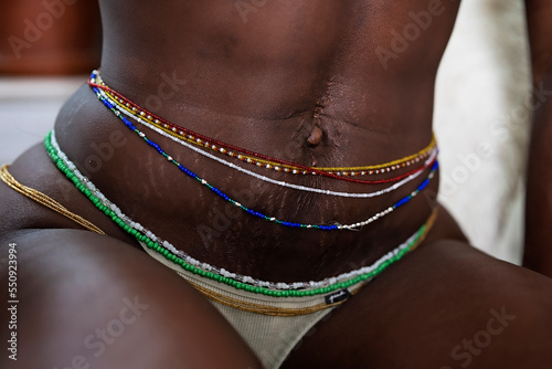 Black woman wearing waistbeads