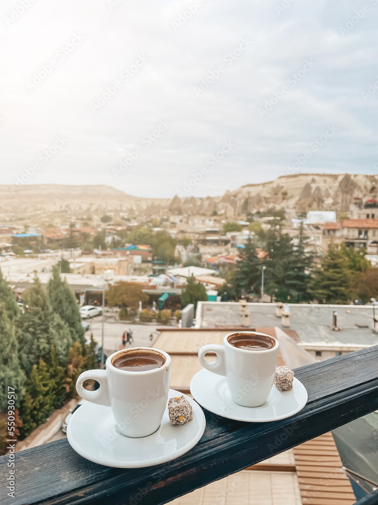 Cup with traditional Turkish coffee on a background of a valley in Cappadocia, Turkey.
