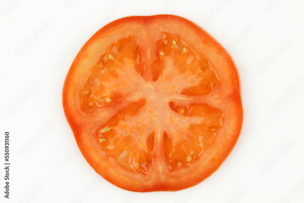 Single slice of tomato isolated on white background Single slice of tomato isolated on white background