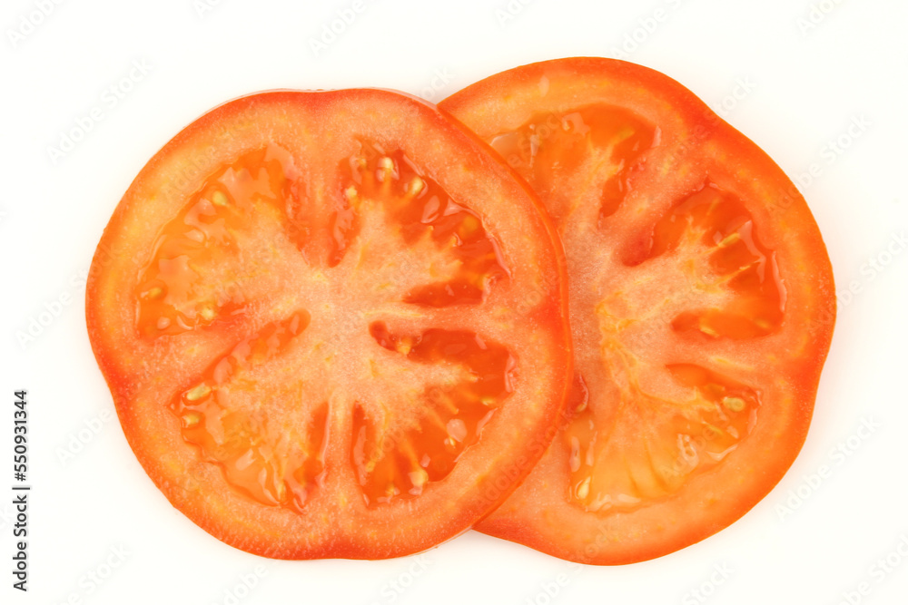 Two slices of tomato isolated on white background Two slices of tomato isolated on white background