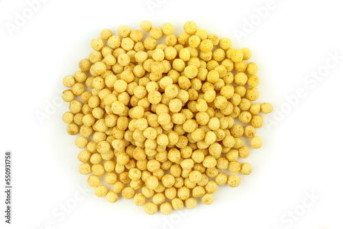 Pile of cereal balls isolated on white background. Healthy breakfast