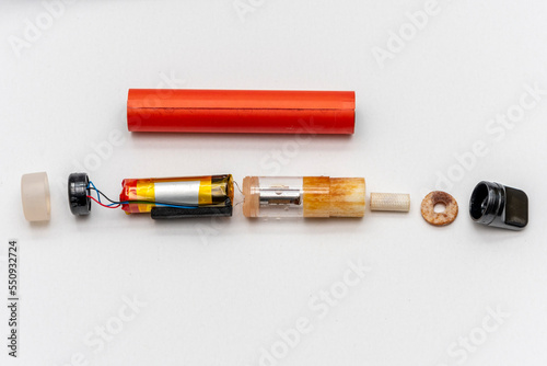 Принти на полотні Disassembled electronic cigarette on a white background, the constituent elements of viper