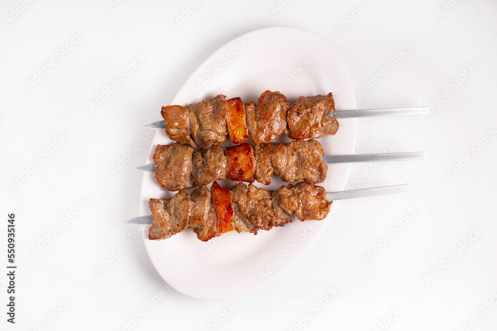 lamb kebab on a white background