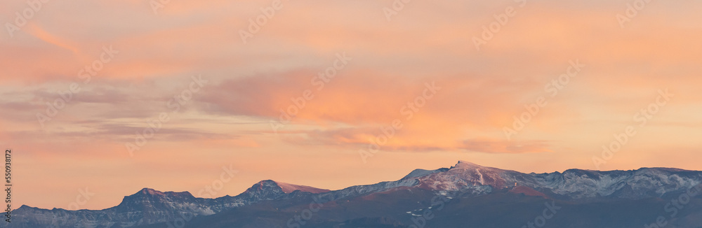 Panoramic of the highest peaks of Sierra Nevada (Granada, Spain) at sunset
