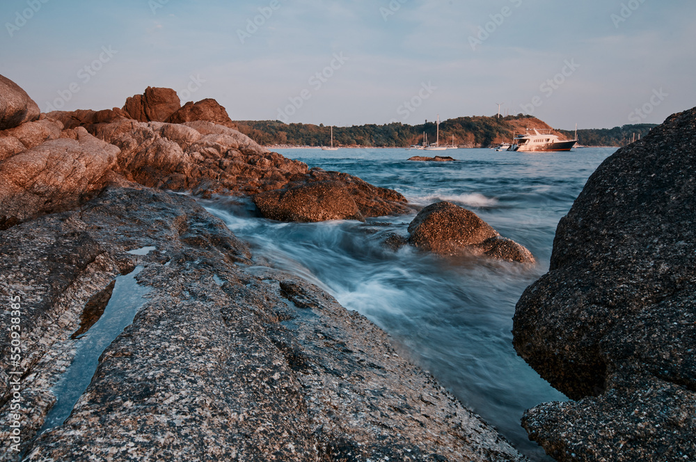 Landscape with sea shore, waves and stones on the rocks beach.