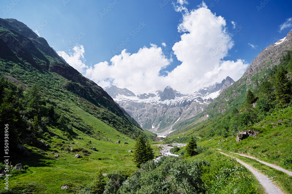 Naklejka premium Beautiful summer lanscape. Hiking through Alps mountains. Travel by Switzerland.