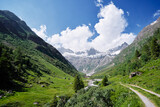 Beautiful summer lanscape. Hiking through Alps mountains. Travel by Switzerland.