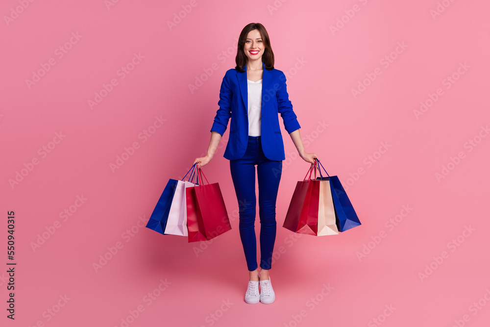 Photo of adorable pretty lady wear blue trendy suit enjoy nice shopping low price clothes isolated on pink color background