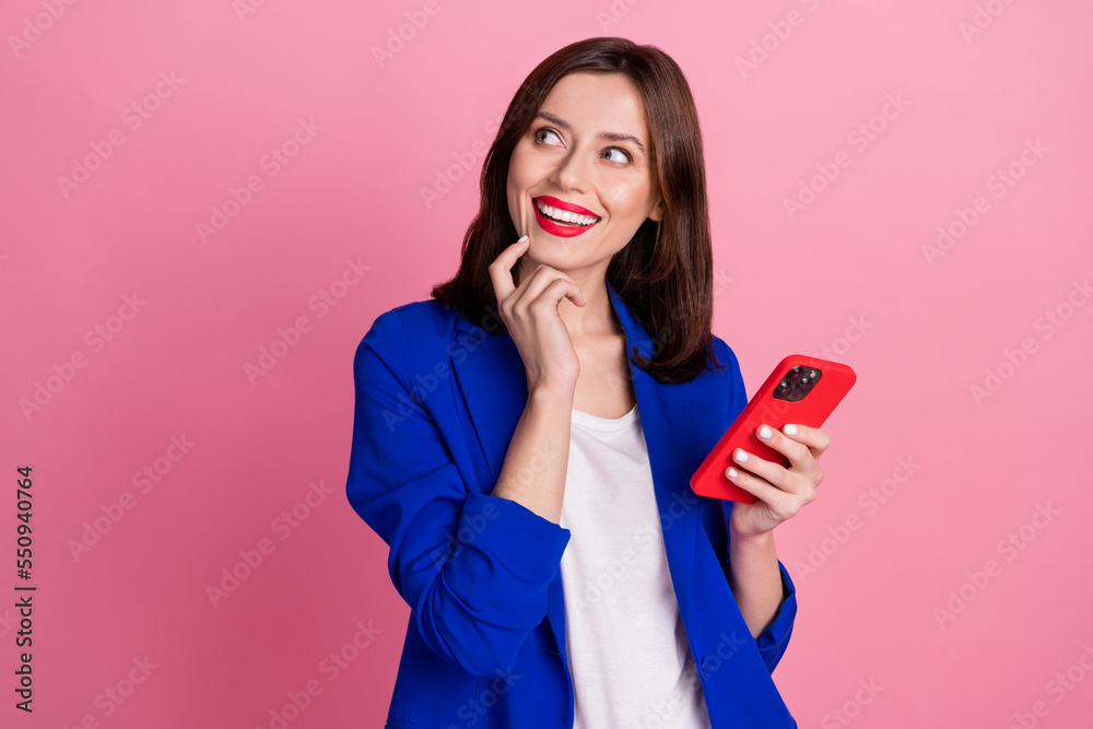 Photo of cheerful lady stylish outfit interested look empty space cool offer low prices buy modern device isolated on pink color background