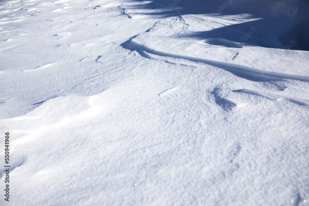 white snowdrifts in cold and sunny winter day.close up