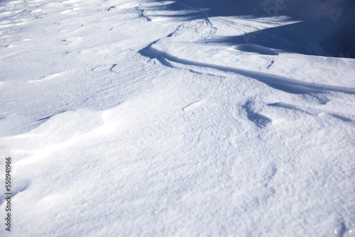 white snowdrifts in cold and sunny winter day.close up © Vahagn