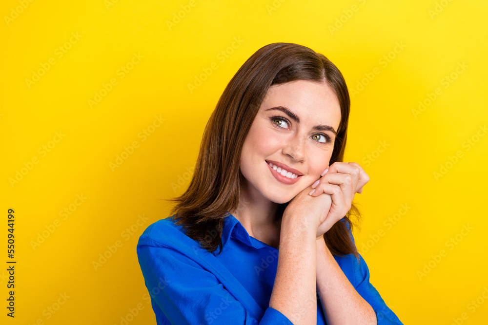 Photo of positive lovely lady hand together near cheeks look empty space offer proposition isolated on yellow color background Photo of positive lovely lady hand together near cheeks look empty space offer proposition isolated on yellow color background
