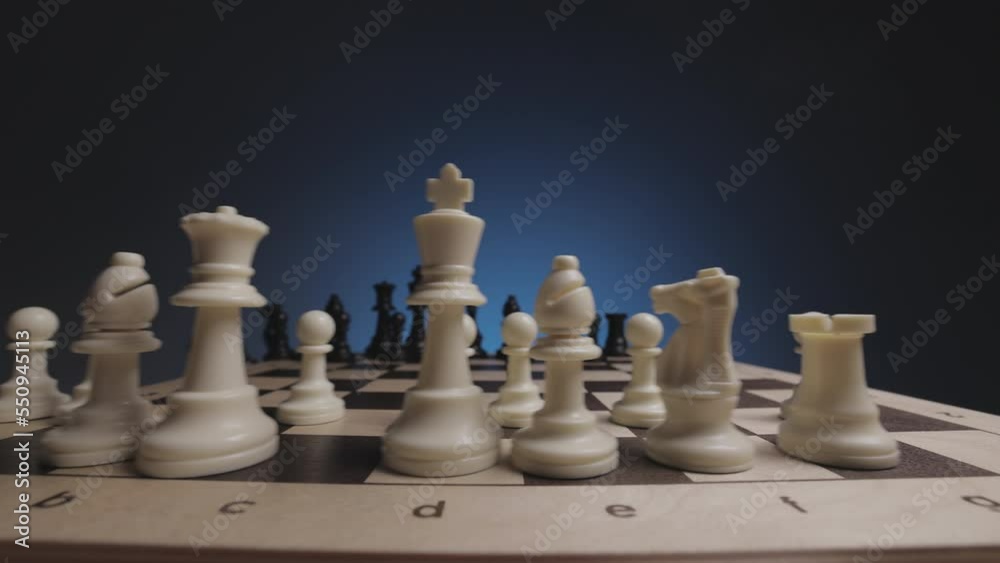 Chess in slowmo falls from the board to the camera. The camera is fixed on a chessboard. Chess in slowmo falls from the board to the camera. The camera is fixed on a chessboard.