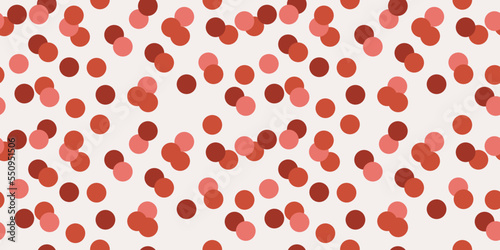 Red circles scattered across the canvas. Seamless pattern, suitable for print and application on the surface of the interior or decor. Stylish design pattern for textile or wallpaper.