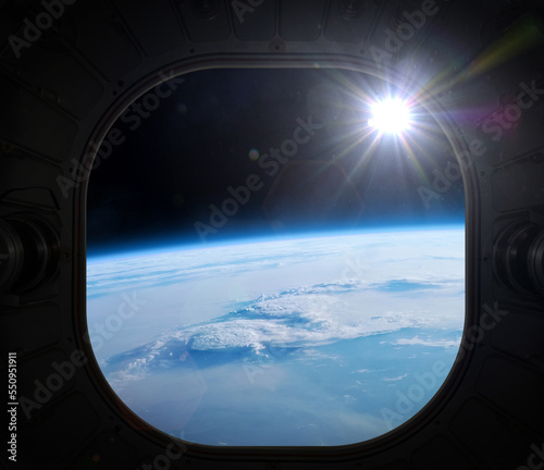Earth  view from the porthole. Elements of this image furnished by NASA.