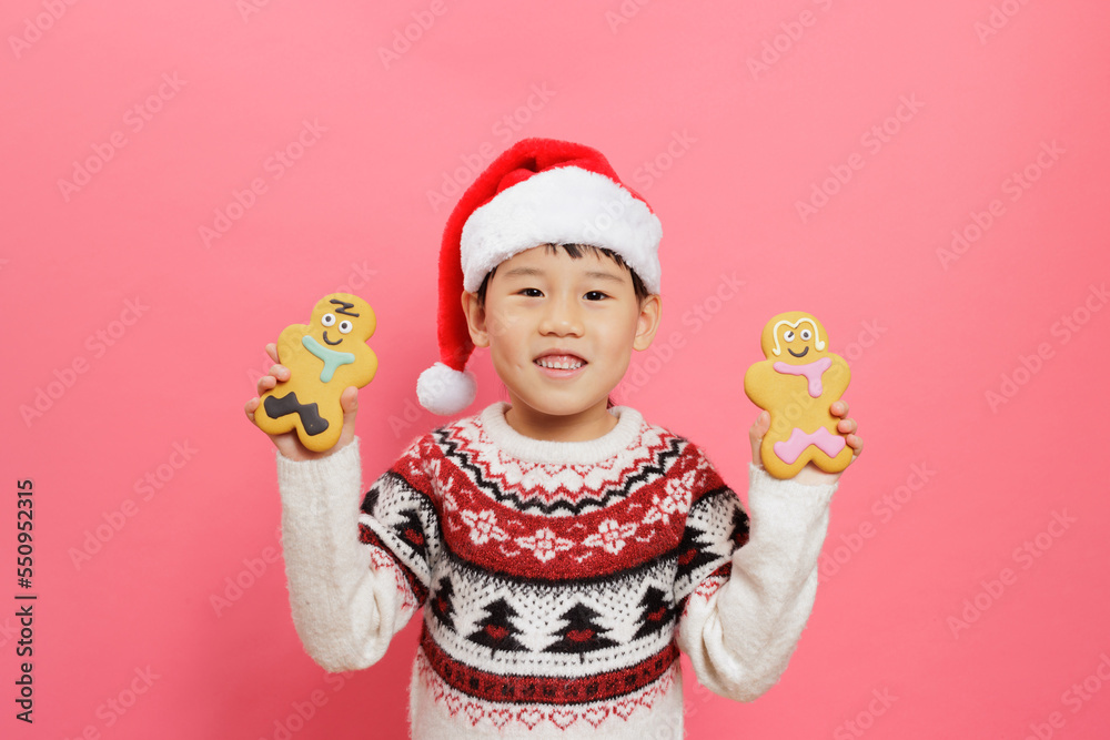 Merry Christmas! Young girl celebrating Christmas against pink background Merry Christmas! Young girl celebrating Christmas against pink background