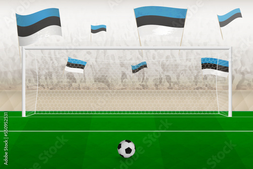 Estonia football team fans with flags of Estonia cheering on stadium, penalty kick concept in a soccer match.
