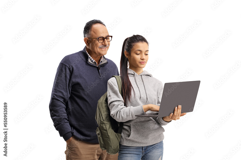 Mature man and a female student standing and using a laptop computer Mature man and a female student standing and using a laptop computer