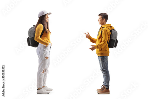 Male teenager talking to a female student