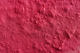 Powder surface close-up, magenta color abstract background