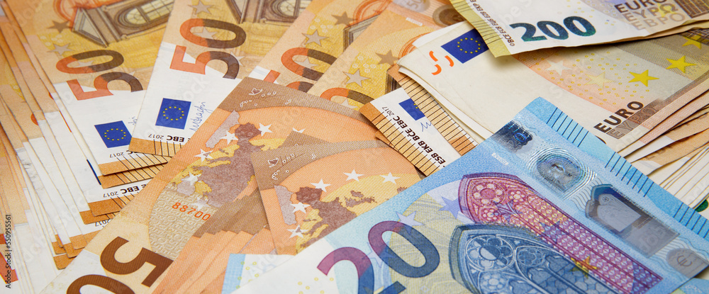  large amount of euro cash of different denominations are on the table. selective focus .High quality photo - obrazy, fototapety, plakaty 