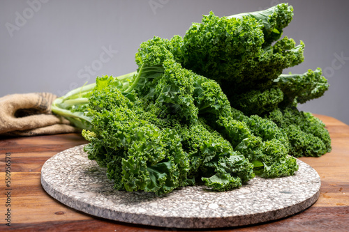 Leaves of winter vegetable green kale cabbage close up photo