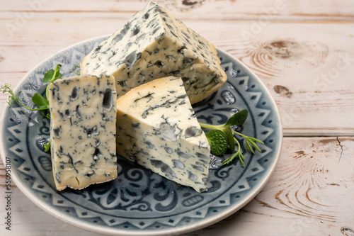 Cheese collection, piece of French blue cheese auvergne or fourme d'ambert photo