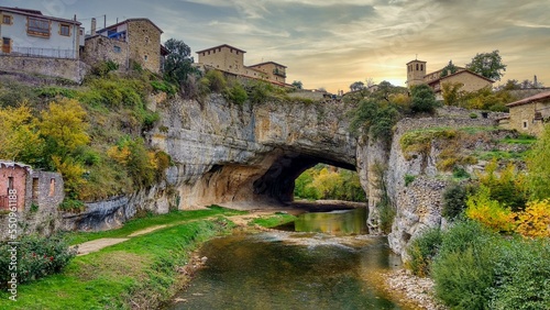 Puentedey village is on a natural bridge over Nela river, Las Merindades, Burgos province, Castilla-León, Castille-Leon, Spain photo