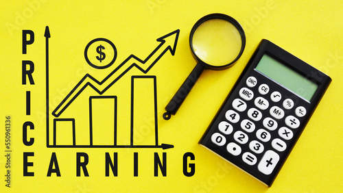 Price and Earning growth ratio are shown ising the text. Investment concept for PE ratio PER and PEG. photo