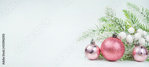 beautiful background postcard with Christmas balls ornament decorations near Christmas tree for Christmas winter on a bokeh background