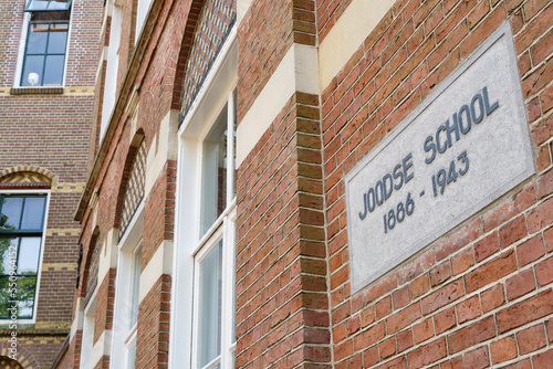 Plaque on the former Jewish school in Leeuwarden in Friesland The Netherlands. Due to German actions in WW2, the primary school closed in 1943. photo