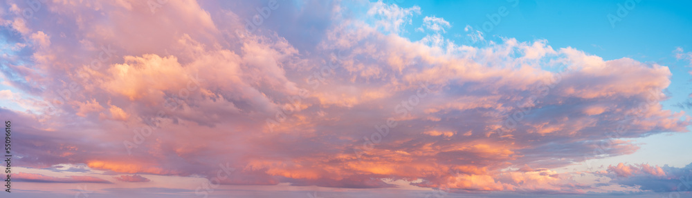 Beautiful panoramic sky with glowing clouds at sunset	